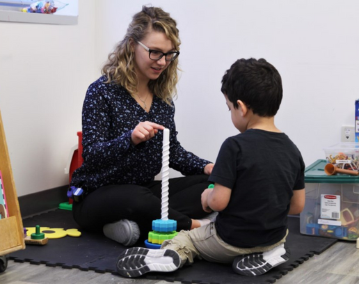 Occupational therapist with child